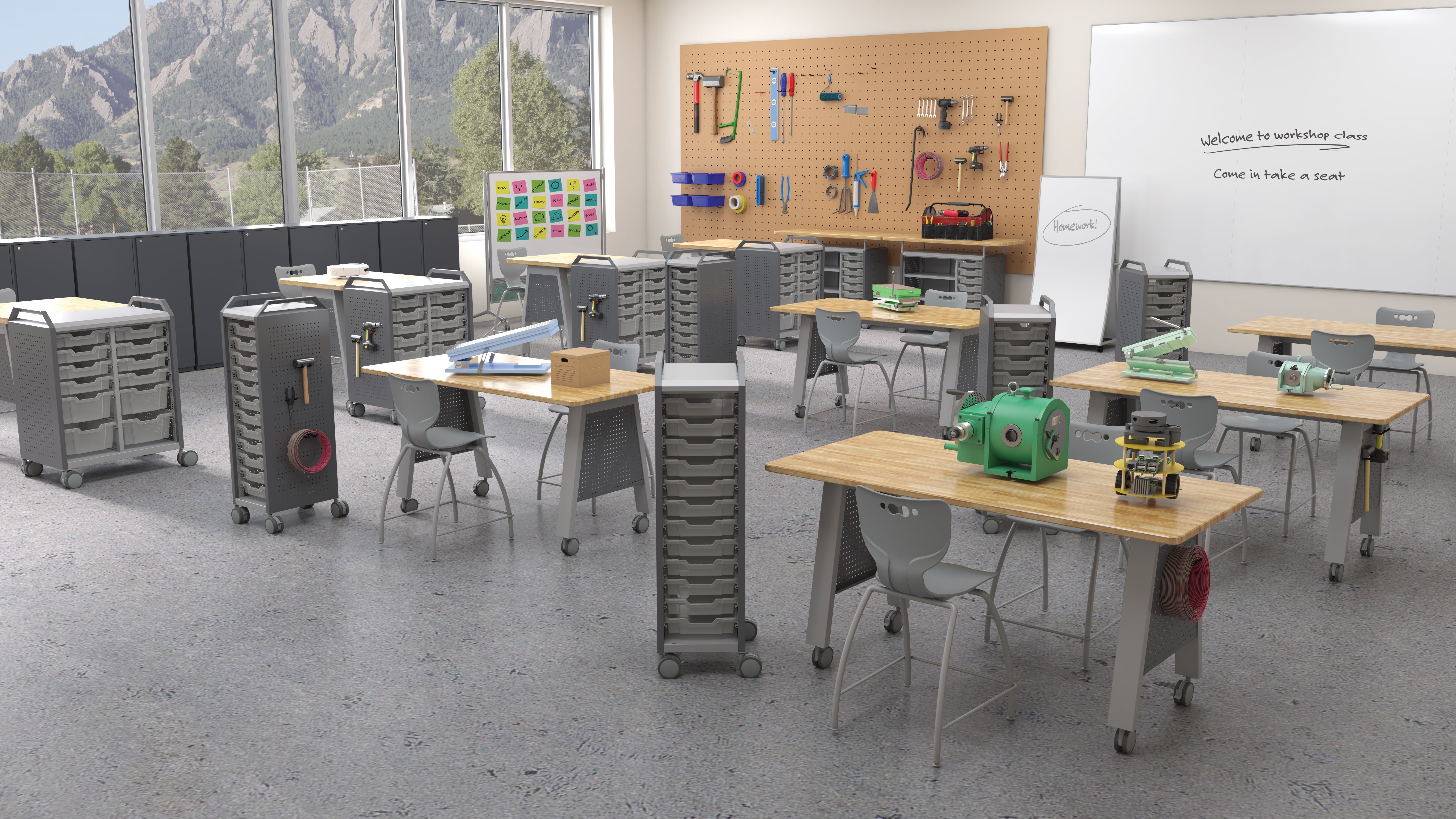 Open makerspace-style classroom zone with moveable tables, writable walls, and visible art and project materials