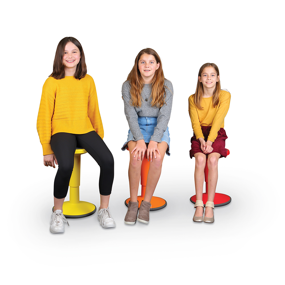 Student sitting on a Wobble Stool, with the stool's rounded base allowing natural side-to-side rocking movement