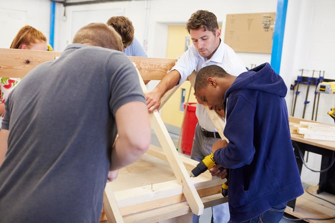 Students building in a workshop